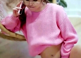 A smallish dark-haired in a pink sweater loves phone hookup